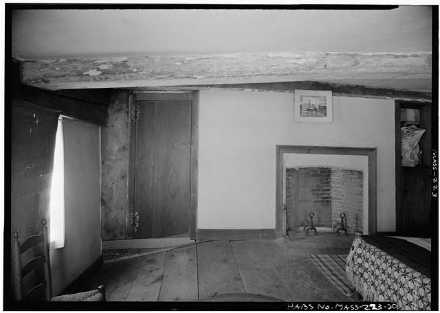 Photograph of a fireplace and door in the Fairbanks House