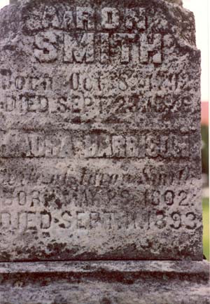 Side of the monument showing information for Aaron and Laura (Harrison) Smith