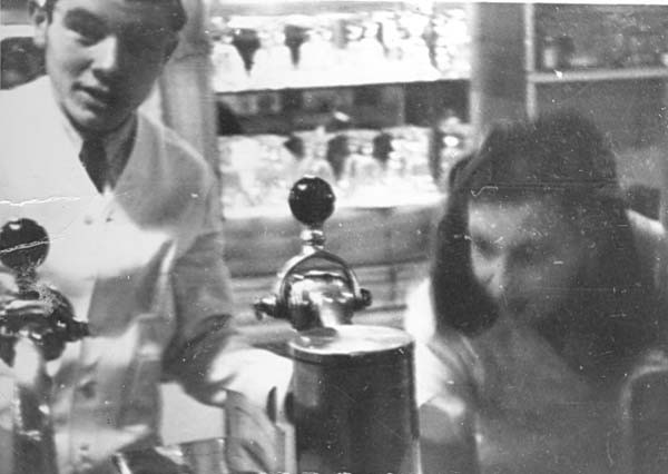 Andy and a young woman at perhaps a soda fountain